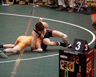 Canfield 126 pound wrestler McCoy Watkins Burcsak gets a hold on Claymont 126 pound wrestler Seth Ferguson in the quarter finals of the OHSAA State Wrestling Dual Team Tournament, Sunday, Feb. 11, 2018, at Ohio State University's St. John Arena in Columbus...(Nikos Frazier | The Vindicator)