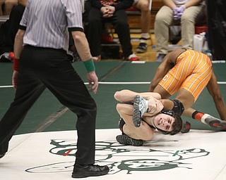 Canfield 132 pound wrestler Aidan Burcsak attempts to hold onto Claymont 132 pound wrestler Jerome Tucker's leg in the quarter finals of the OHSAA State Wrestling Dual Team Tournament, Sunday, Feb. 11, 2018, at Ohio State University's St. John Arena in Columbus...(Nikos Frazier | The Vindicator)