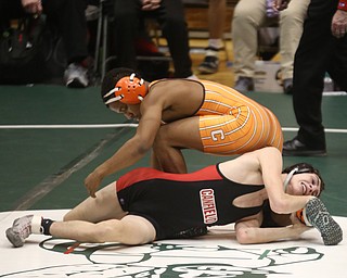 Canfield 132 pound wrestler Aidan Burcsak attempts to hold onto Claymont 132 pound wrestler Jerome Tucker's leg in the quarter finals of the OHSAA State Wrestling Dual Team Tournament, Sunday, Feb. 11, 2018, at Ohio State University's St. John Arena in Columbus...(Nikos Frazier | The Vindicator)