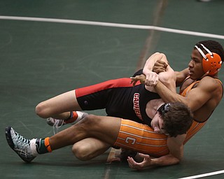 Claymont 132 pound wrestler Jerome Tucker pulls back on Canfield 132 pound wrestler Aidan Burcsak in the quarter finals of the OHSAA State Wrestling Dual Team Tournament, Sunday, Feb. 11, 2018, at Ohio State University's St. John Arena in Columbus...(Nikos Frazier | The Vindicator)