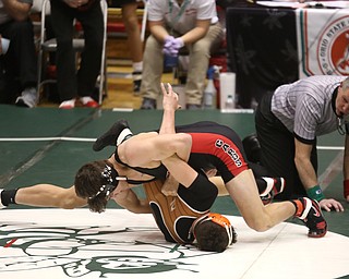 Canfield 160 pound wrestler Ben Cutrer attempts to pin Claymont 160 pound wrestler Kaden Bunting in the quarter finals of the OHSAA State Wrestling Dual Team Tournament, Sunday, Feb. 11, 2018, at Ohio State University's St. John Arena in Columbus...(Nikos Frazier | The Vindicator)