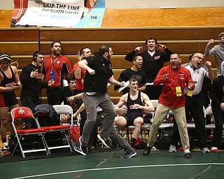 The Canfield bench reacts to Ben Cutrer's pin in the quarter finals of the OHSAA State Wrestling Dual Team Tournament, Sunday, Feb. 11, 2018, at Ohio State University's St. John Arena in Columbus...(Nikos Frazier | The Vindicator)