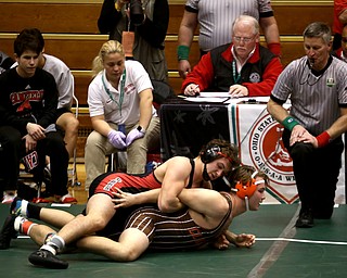 Canfield 195 pound wrestler Nick Crawford attempts a pin on Claymont 195 pound wrestler Blake Linard in the quarter finals of the OHSAA State Wrestling Dual Team Tournament, Sunday, Feb. 11, 2018, at Ohio State University's St. John Arena in Columbus...(Nikos Frazier | The Vindicator)