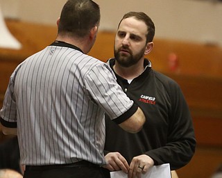 Canfield head coach Stephen Pitts talks with an official during Wauseon 120 pound wrestler Alex Slattman and Canfield 120 pound wrestler Nick Barber bout in the semi finals of the OHSAA State Wrestling Dual Team Tournament, Sunday, Feb. 11, 2018, at Ohio State University's St. John Arena in Columbus...(Nikos Frazier | The Vindicator)