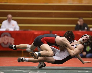 Wauseon 126 pound wrestler Nolan Ray pulls Canfield 126 pound wrestler McCoy Watkins onto the mat in the semi finals of the OHSAA State Wrestling Dual Team Tournament, Sunday, Feb. 11, 2018, at Ohio State University's St. John Arena in Columbus...(Nikos Frazier | The Vindicator)