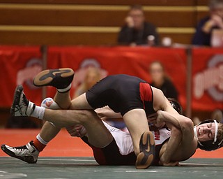 Wauseon 126 pound wrestler Nolan Ray pulls Canfield 126 pound wrestler McCoy Watkins onto the mat in the semi finals of the OHSAA State Wrestling Dual Team Tournament, Sunday, Feb. 11, 2018, at Ohio State University's St. John Arena in Columbus...(Nikos Frazier | The Vindicator)