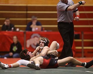 Wauseon 126 pound wrestler Nolan Ray attempts to pin Canfield 126 pound wrestler McCoy Watkins in the semi finals of the OHSAA State Wrestling Dual Team Tournament, Sunday, Feb. 11, 2018, at Ohio State University's St. John Arena in Columbus...(Nikos Frazier | The Vindicator)