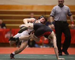 Wauseon 152 pound wrestler Gage Grunden grabs onto Canfield 152 pound wrestler David Reinhart's legs in the semi finals of the OHSAA State Wrestling Dual Team Tournament, Sunday, Feb. 11, 2018, at Ohio State University's St. John Arena in Columbus...(Nikos Frazier | The Vindicator)