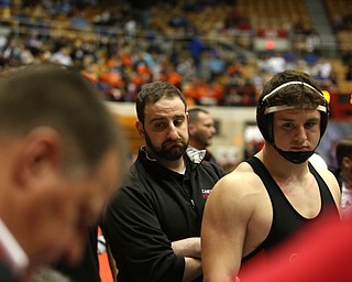 Canfield head coach Stephen Pitts(center) and Tyler Stein watch as the final matches are tallied resulting in a 33-38 loss to Wauseon in the semi finals of the OHSAA State Wrestling Dual Team Tournament, Sunday, Feb. 11, 2018, at Ohio State University's St. John Arena in Columbus...(Nikos Frazier | The Vindicator)