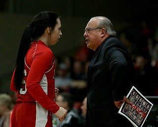 Columbiana's Kennedy Fullum (15) and Columbiana head coach Ron Moschella speak in the first quarter of an OHSAA high school basketball game, Monday, Feb. 12, 2018, in Struthers. Struthers won 61-52...(Nikos Frazier | The Vindicator)