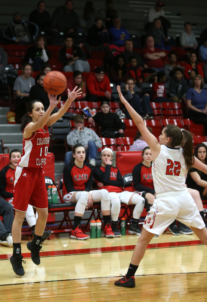 Columbiana's Grace Hammond (10) goes up for three as Struthers' Michelle Buser (22) attempts to block her shot in the second quarter of an OHSAA high school basketball game, Monday, Feb. 12, 2018, in Struthers. Struthers won 61-52...(Nikos Frazier | The Vindicator)