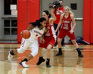 Struthers' Khaylah Brown (1) dribbles into Columbiana's Grace Hammond (10) in the second quarter of an OHSAA high school basketball game, Monday, Feb. 12, 2018, in Struthers. Struthers won 61-52...(Nikos Frazier | The Vindicator)