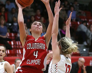 Columbiana's Kayla Muslovki (4) goes up for a layup past Struthers' Alexis Bury (13) in the second quarter of an OHSAA high school basketball game, Monday, Feb. 12, 2018, in Struthers. Struthers won 61-52...(Nikos Frazier | The Vindicator)