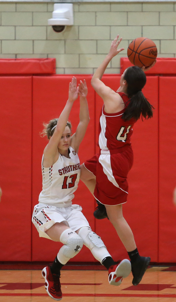 Columbiana's Kayla Muslovki (4) goes up for a layup on top of Struthers' Alexis Bury (13) in the fourth quarter of an OHSAA high school basketball game, Monday, Feb. 12, 2018, in Struthers. Struthers won 61-52...(Nikos Frazier | The Vindicator)