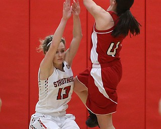 Columbiana's Kayla Muslovki (4) goes up for a layup on top of Struthers' Alexis Bury (13) in the fourth quarter of an OHSAA high school basketball game, Monday, Feb. 12, 2018, in Struthers. Struthers won 61-52...(Nikos Frazier | The Vindicator)