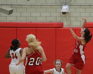 Columbiana's Kayla Muslovki (4) goes up for a layup on top of Struthers' Alexis Bury (13) in the fourth quarter of an OHSAA high school basketball game, Monday, Feb. 12, 2018, in Struthers. Struthers won 61-52...(Nikos Frazier | The Vindicator)