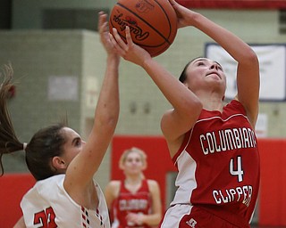 Columbiana's Kayla Muslovki (4)'s layup is blocked by Struthers' Michelle Buser (22) in the fourth quarter of an OHSAA high school basketball game, Monday, Feb. 12, 2018, in Struthers. Struthers won 61-52...(Nikos Frazier | The Vindicator)