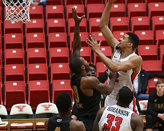 Youngstown State forward Devin Haygood (2) goes up for a layup over Oakland forward Isaiah Brock (10) in the first half of an NCAA Horizon League college basketball game, Wednesday, Feb. 14, 2018, in Youngstown. YSU won 75-73...(Nikos Frazier | The Vindicator)