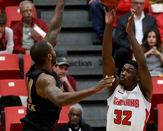 Youngstown State guard Garrett Covington (32) goes up for three over Oakland forward Isaiah Brock (10) in the first half of an NCAA Horizon League college basketball game, Wednesday, Feb. 14, 2018, in Youngstown. YSU won 75-73...(Nikos Frazier | The Vindicator)