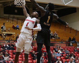 Youngstown State guard Braun Hartfield (1) goes up for a layup as Oakland guard Kendrick Nunn (1) blocks his shot in the first half of an NCAA Horizon League college basketball game, Wednesday, Feb. 14, 2018, in Youngstown. YSU won 75-73...(Nikos Frazier | The Vindicator)