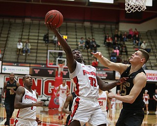 Youngstown State guard Garrett Covington (32) goes up for a layup against Oakland forward Chris Palombizio (15) in the first half of an NCAA Horizon League college basketball game, Wednesday, Feb. 14, 2018, in Youngstown. YSU won 75-73...(Nikos Frazier | The Vindicator)