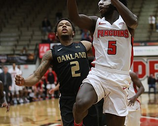 Youngstown State guard Jeremiah Ferguson (5) goes up for a layup past Oakland guard Nick Daniels (2) in the first half of an NCAA Horizon League college basketball game, Wednesday, Feb. 14, 2018, in Youngstown. YSU won 75-73...(Nikos Frazier | The Vindicator)