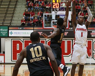 Youngstown State guard Braun Hartfield (1) goes up for three over Oakland guard Brailen Neely (11) in the second half of an NCAA Horizon League college basketball game, Wednesday, Feb. 14, 2018, in Youngstown. YSU won 75-73...(Nikos Frazier | The Vindicator)