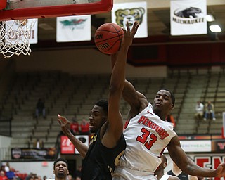 Youngstown State forward Naz Bohannon (33) spikes the ball from Oakland forward Jalen Hayes (4) in the second half of an NCAA Horizon League college basketball game, Wednesday, Feb. 14, 2018, in Youngstown. YSU won 75-73...(Nikos Frazier | The Vindicator)