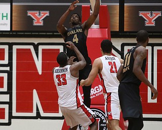 Oakland forward Jalen Hayes (4) goes up for two from behing the basket past Youngstown State forward Naz Bohannon (33) and Youngstown State forward Noe Anabir (21) in the second half of an NCAA Horizon League college basketball game, Wednesday, Feb. 14, 2018, in Youngstown. YSU won 75-73...(Nikos Frazier | The Vindicator)