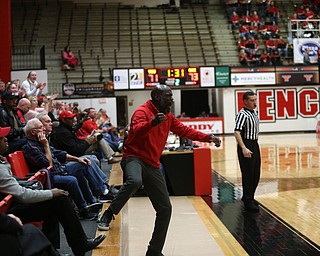 John Covington reacts to his son, Youngstown State guard Garrett Covington (32)'s basket in the second half of an NCAA Horizon League college basketball game, Wednesday, Feb. 14, 2018, in Youngstown. YSU won 75-73...(Nikos Frazier | The Vindicator)