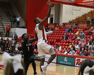 Youngstown State guard Braun Hartfield (1) goes up for a layup past Oakland guard Kendrick Nunn (1) in the second half of an NCAA Horizon League college basketball game, Wednesday, Feb. 14, 2018, in Youngstown. YSU won 75-73...(Nikos Frazier | The Vindicator)