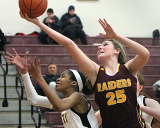 William D. Lewis The Vindicator   South Range's Dani Vuletich (25) shoots past Liberty's Sydney Duncan(14) during 2-14-18 action at Liberty.