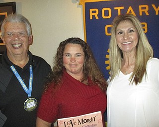 Shannon Lehn and Christine Vlosich spoke to Rotary Club of Austintown members about Family First Adult Day Services, 4199 Kirk Road in the former Lynn Kirk Church, which will be opening soon. The service will provide meals and snacks from 8 a.m. to 4:30 p.m. weekdays. Lehn and Vlosich said the service provides transportation within a seven mile radius and flexible days of service to allow caregivers a break and give them peace of mind that there are well-trained employees on staff. The program promotes wellness, independence and self worth while celebrating the uniqueness of each participant. Above, from left, are Bruce Laraway, Rotary president; Lehn, holding a book that will be donated to Austintown Elementary School in honor of the speakers; and Vlosich.