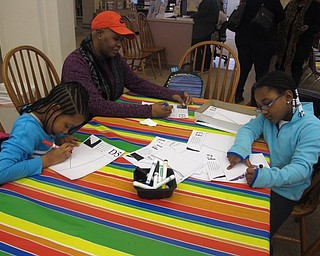 Neighbors | Zack Shively.Jennifer Kuczek offered a literary exploration on slavery to finish the Black History events on Feb. 3. She had a number of children's literature to focused on slavery and had a number of activities, such as the coloring activity pictured, for the families at the event.