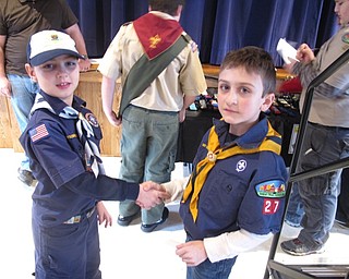 Neighbors | Zack Shively.The Pinewood Derby races taught the Cub Scouts two things: to build and design a wooden car for racing and sportsmanship. The Scouts practiced good sportsmanship throughout the day, celebrating everyone's successes. Pictured, from left, Caden Brown and Ryder Naughton demonstated good sportsmanship by shaking hands before they raced.
