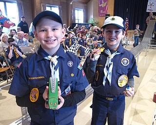 Neighbors | Zack Shively.The Cub Scouts had less than two months to create their cars for the Pinewood Derby. Some used the cars to make interesting designs and shapes, such as Liam Feehley's green monster design on the left and Carson Galich's arrow shaped car on the right.