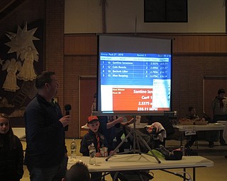 Neighbors | Zack Shively.The Pinewood Derby used a computer program to show the racers' names, placement, time and average speed. The scout leaders set up a projector to display the results to the audience watching the races.