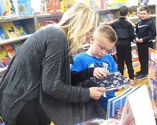 Neighbors | Zack Shively.Poland Union Elementary had a Scholastic book fair at their school from Jan. 29 to Feb. 2. Classes visited the book fair, set on the stage of the gymnasium, throughout the week.
