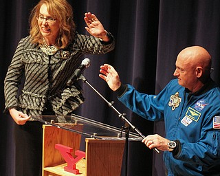 William D. Lewis the vindicator   Retired NASA astronaut Mike Kelly, husband of Gabby Giffords adjusts microphone while Giffords waves to the crowd as part of Skeggs lecture series 2-15-18 at Stambaugh Auditorium.