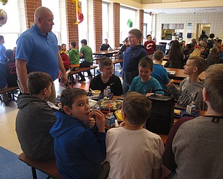 Neighbors | Zack Shively.No One Eats Alone Day aims to fight social isolation. Austintown Intermediate brought in members of the community and teachers to sit and talk with the students during their lunches. Pictured, Detective Sergeant Shawn Hevener joked with a group of students.