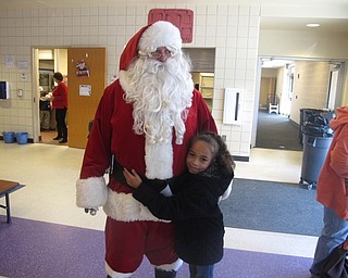 Neighbors | Zack Shively.Santa visited Austintown Elementary School on Dec. 20. Pictured, Santa visited lunch and met with some students while they ate.