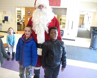 Neighbors | Zack Shively.Santa went to each of the classrooms throughout the elementary school. All of the students took pictures with Santa, which the PTA sent home to the students' families.