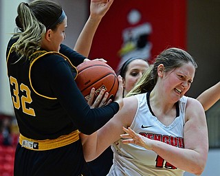 YOUNGSTOWN, OHIO - FEBRUARY 15, 2018: Youngstown State's Mary Dunn has the ball ripped away by Milwaukee's Steph Kostowicz during the first half of their game on Thursday night at Beeghly Center. DAVID DERMER | THE VINDICATOR