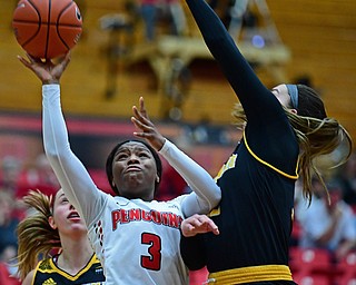 YOUNGSTOWN, OHIO - FEBRUARY 15, 2018: Youngstown State's Indiya Benjamin goes to the basket against Milwaukee's Steph Kostowicz during the first half of their game on Thursday night at Beeghly Center. DAVID DERMER | THE VINDICATOR