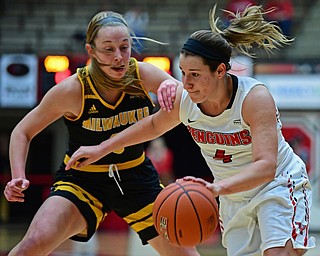 YOUNGSTOWN, OHIO - FEBRUARY 15, 2018: Youngstown State's Nikki Arbanas drives on Milwaukee's McKaela Schmelzer during the first half of their game on Thursday night at Beeghly Center. DAVID DERMER | THE VINDICATOR