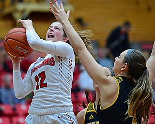 YOUNGSTOWN, OHIO - FEBRUARY 15, 2018: Youngstown State's Chelsea Olsen goes to the basket against Milwaukee's Bailey Farley during the first half of their game on Thursday night at Beeghly Center. DAVID DERMER | THE VINDICATOR
