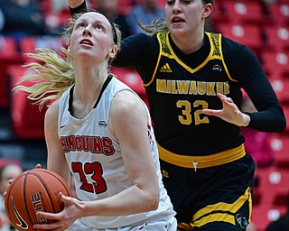 YOUNGSTOWN, OHIO - FEBRUARY 15, 2018: Youngstown State's Sarah Cash goes to the basket against Milwaukee's Steph Kostowicz during the first half of their game on Thursday night at Beeghly Center. DAVID DERMER | THE VINDICATOR