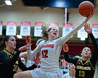 YOUNGSTOWN, OHIO - FEBRUARY 15, 2018: Youngstown State's Chelsea Olsen, center, grabs a rebound away from Milwaukee's Brandi Bisping, right, and Steph Kostowicz during the second half of their game, Thursday night. Youngstown State won in overtime 86-85. DAVID DERMER | THE VINDICATOR