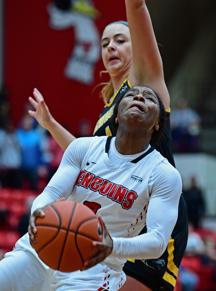 YOUNGSTOWN, OHIO - FEBRUARY 15, 2018: Youngstown State's Indiya Benjamin goes to the basket against Milwaukee's Bailey Farley during the second half of their game, Thursday night. Youngstown State won in overtime 86-85. DAVID DERMER | THE VINDICATOR..This shot would tie the game and help force overtime.