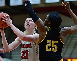 YOUNGSTOWN, OHIO - FEBRUARY 15, 2018: Youngstown State's Sarah Cash goes to the basket against Milwaukee's Ryan Johnson during overtime of their game, Thursday night. Youngstown State won in overtime 86-85. DAVID DERMER | THE VINDICATOR